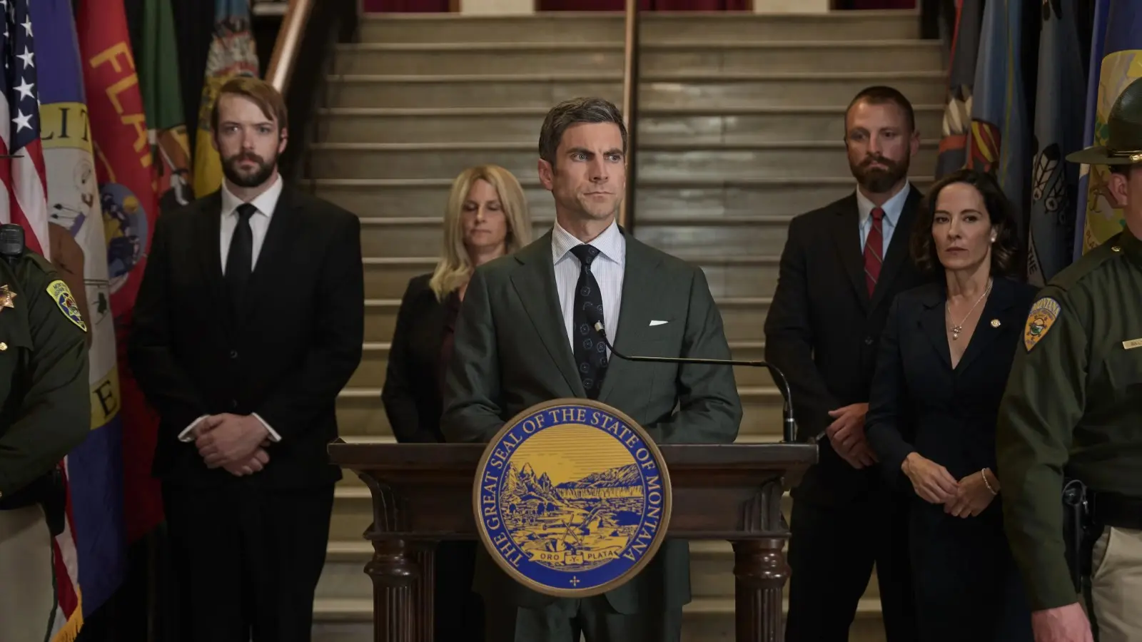 Yellowstone Season 5 Part 2: Wes Bentley as Jamie Dutton standing behind a podium