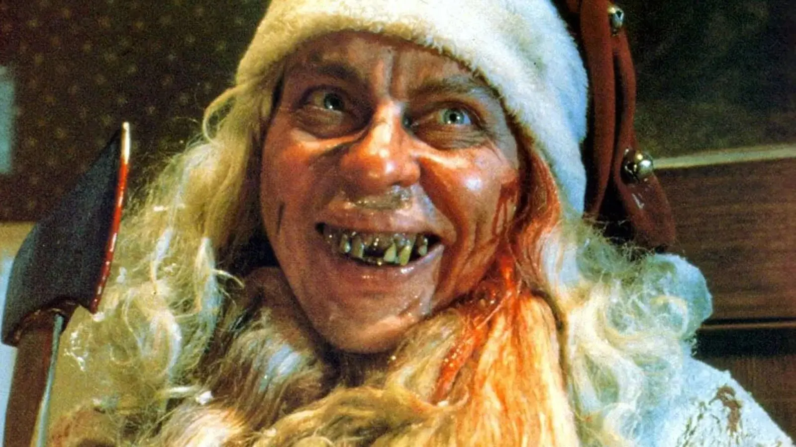 Larry Drake as a grinning Santa Claus in Tales From the Crypt episode 'And All Through the House.'