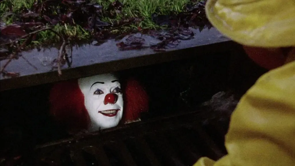 Tim Curry as Pennywise in IT