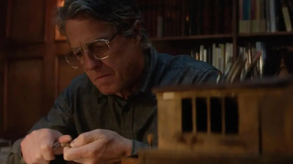 Hugh Grant working with wood in Heretic.