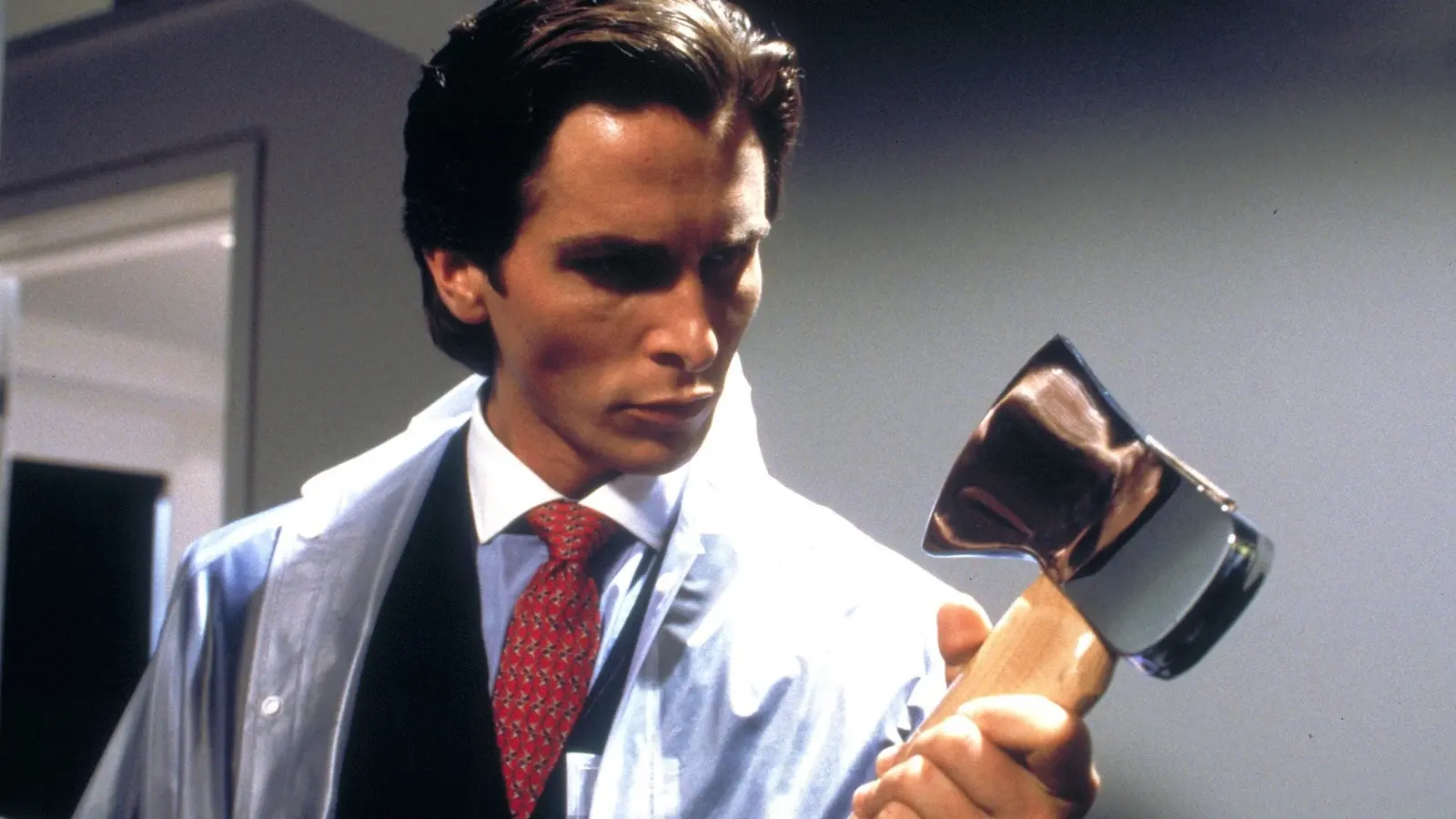 American Psycho: Christian Bale as Patrick Bateman holding an axe