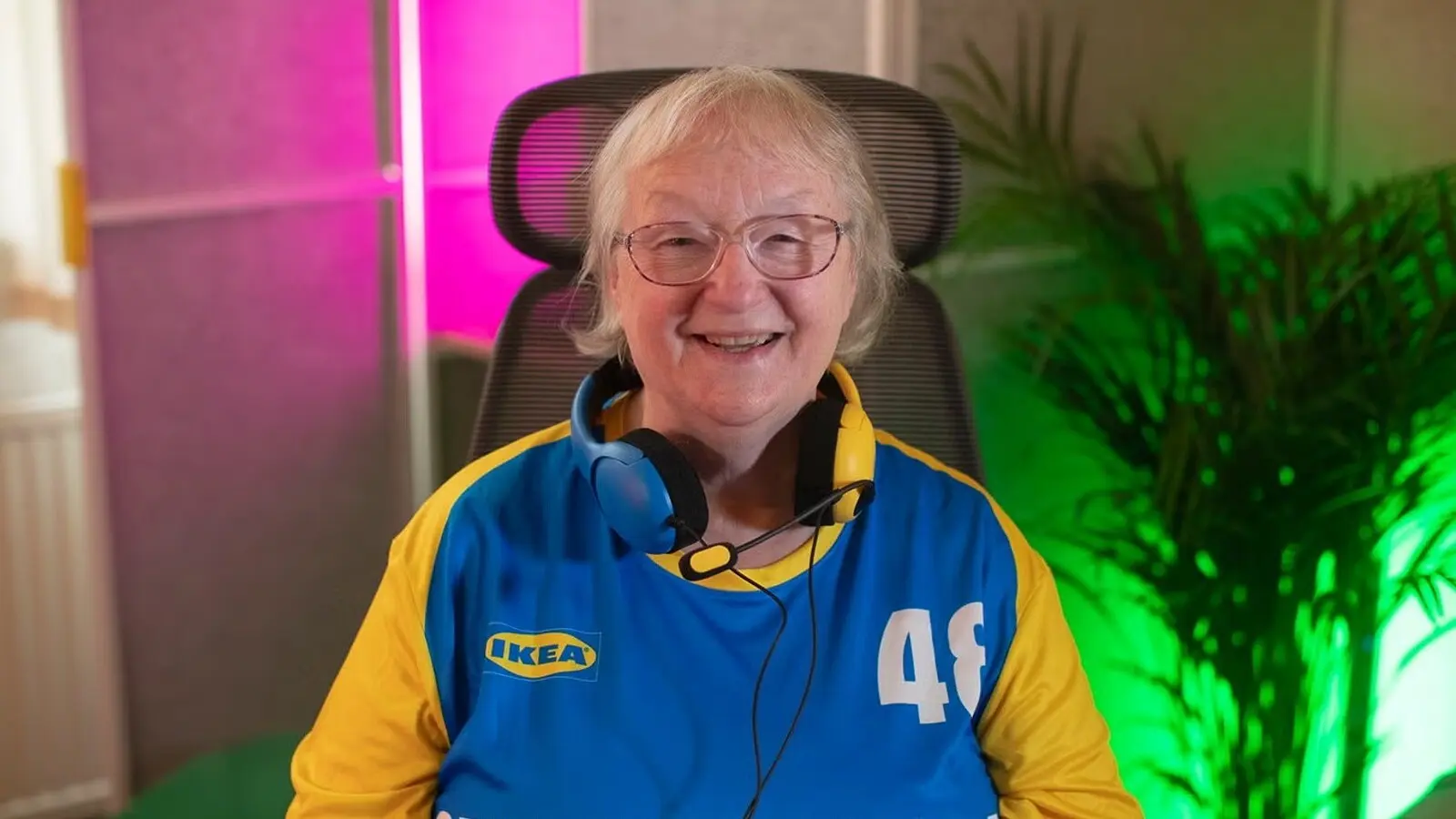 GrumpyGran looks at the camera and smiles in her streaming room