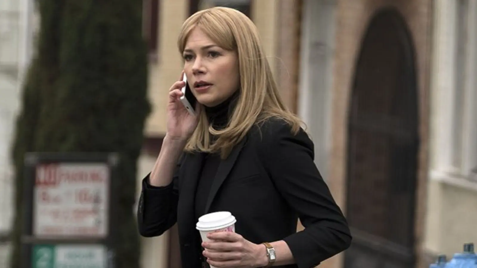 Michelle Williams on phone in Venom.