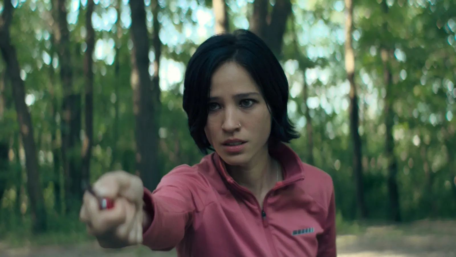 Don't Move on Netflix: Kelsey Asbille as Iris, holding up a knife