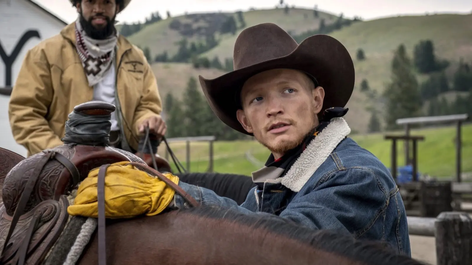 Jefferson White as Jimmy in Yellowstone, saddling up a horse