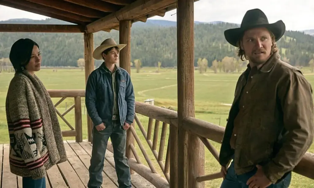 Yellowstone: Monica, Tate, and Kayce standing on their porch