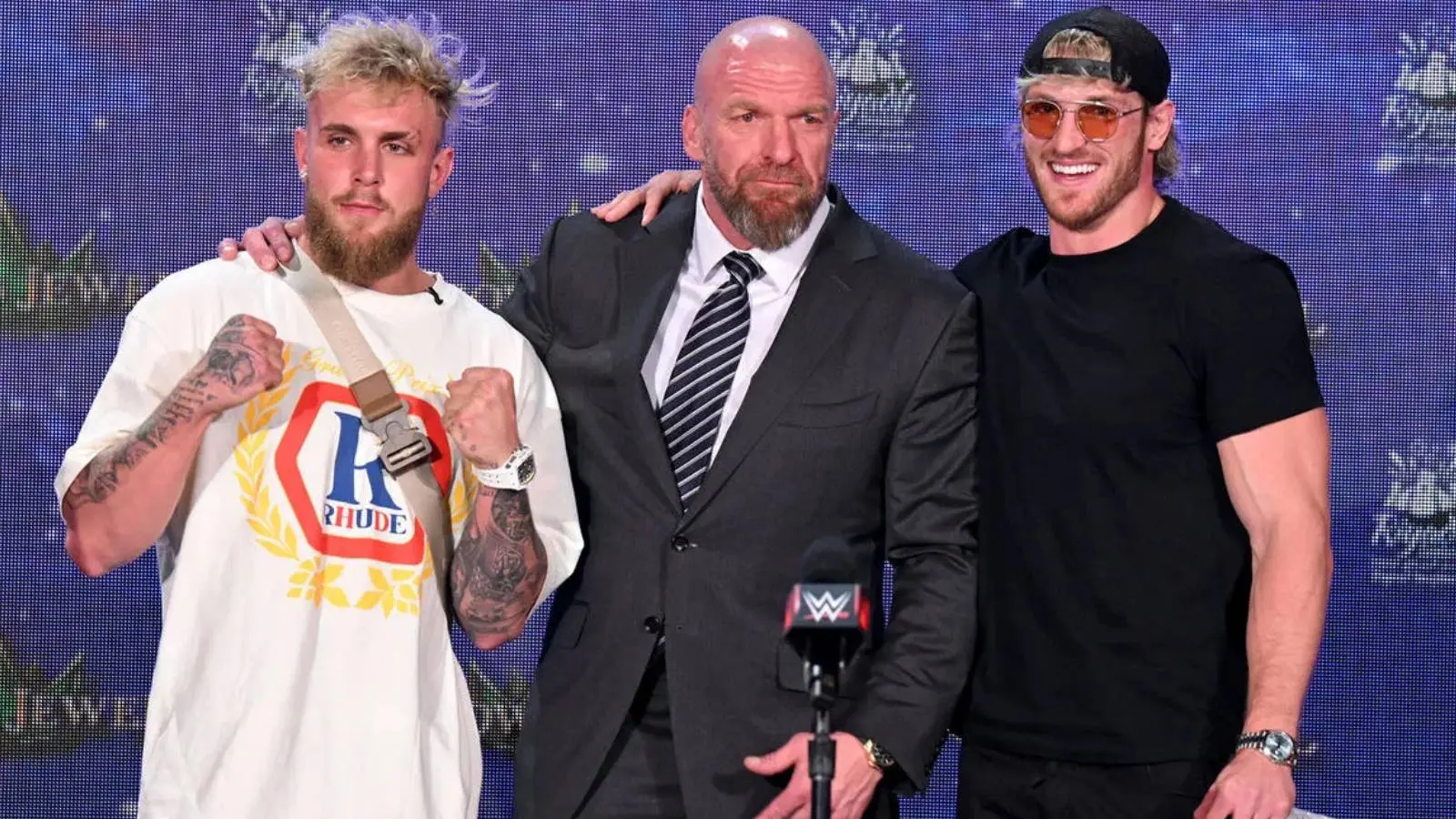 Jake Paul and Logan Paul with Triple H