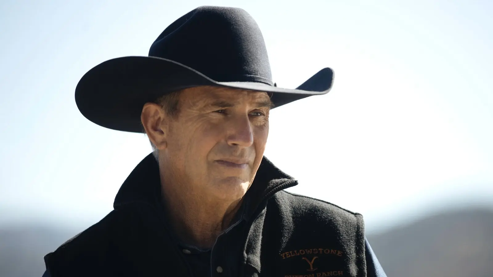 Is Yellowstone based on a true story? Kevin Costner as John Dutton wearing a cowboy hat