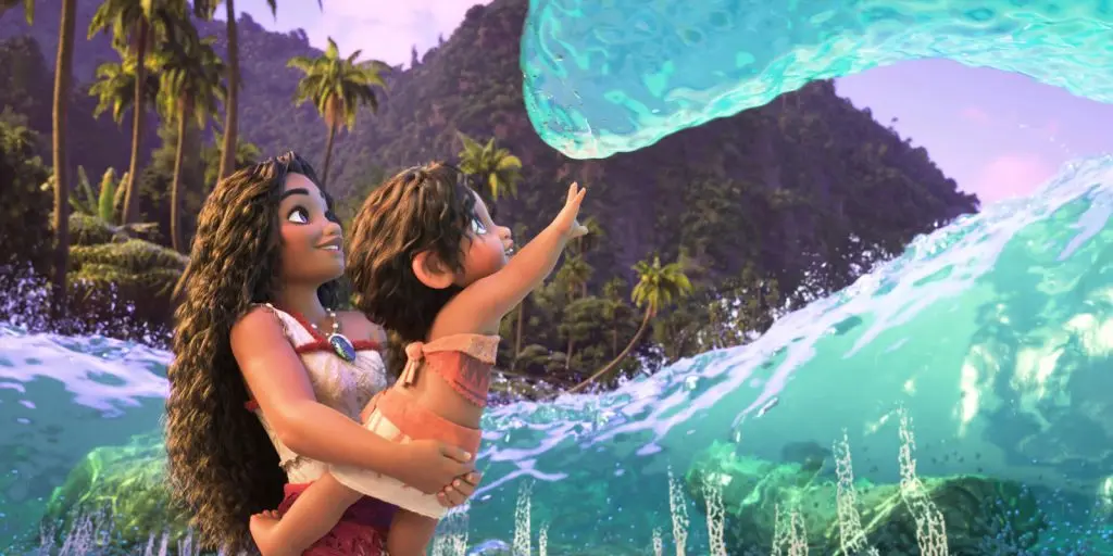 Moana 2 review: Moana holds up her little sister to a wave