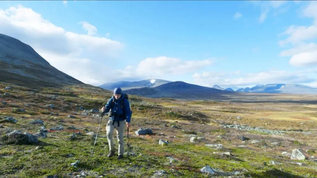 YouTuber walking through mountains