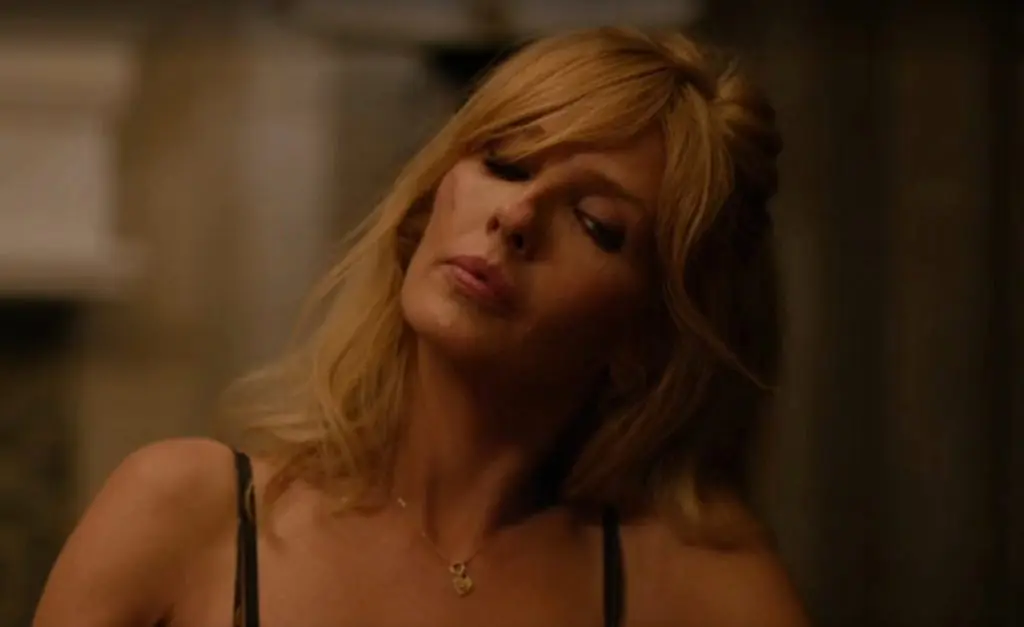 Beth Dutton as Kelley Reilly in Yellowstone during the Travis strip poker scene