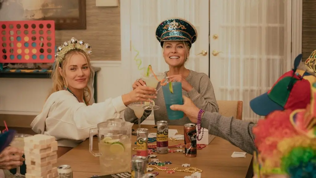 Landman Episode 7 recap: Angela and Ainsley sit at a table with party hats