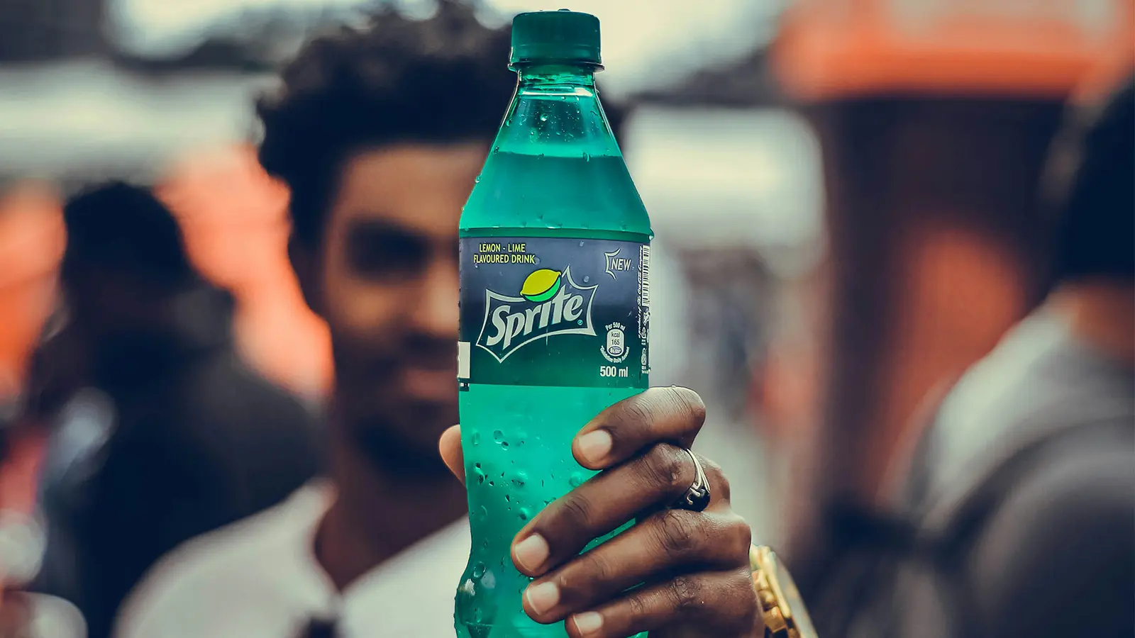 Man holding a sprite bottle