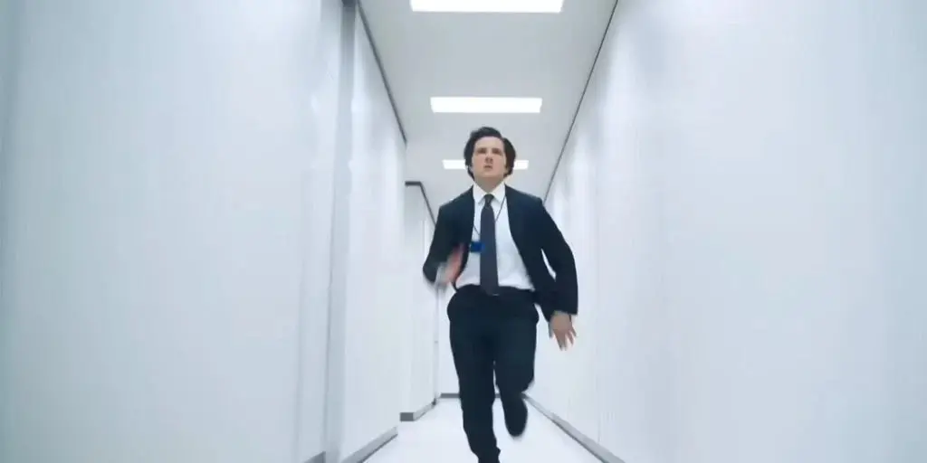 Adam Scott as Mark running in Severance Season 2 Episode 1