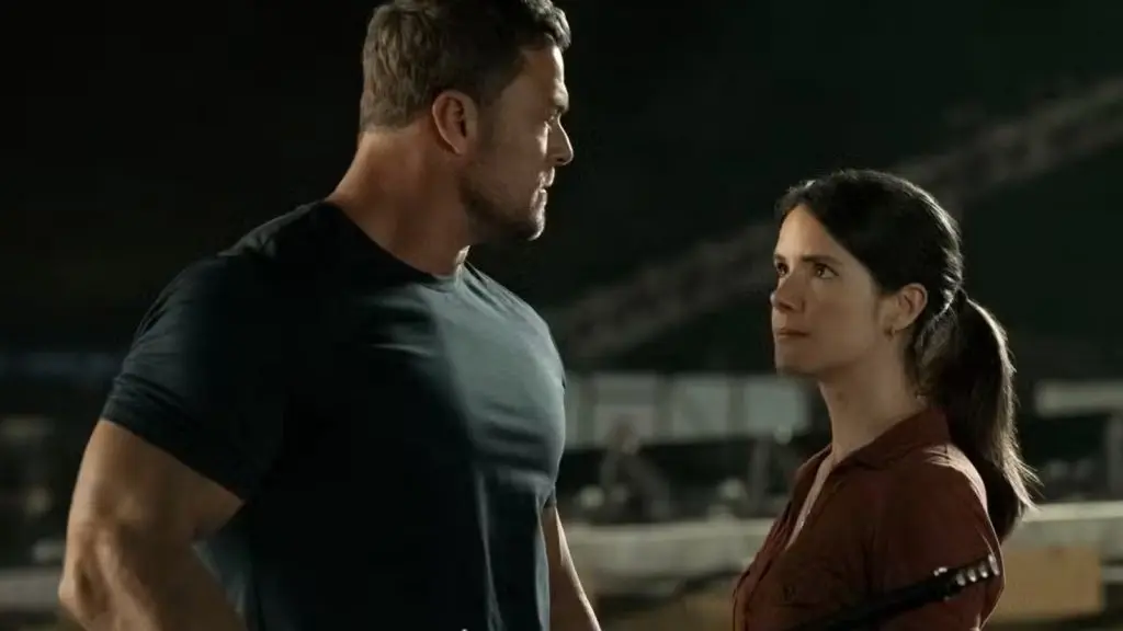 Sonya Cassidy looking up to Alan Ritchson in Reacher Season 3.